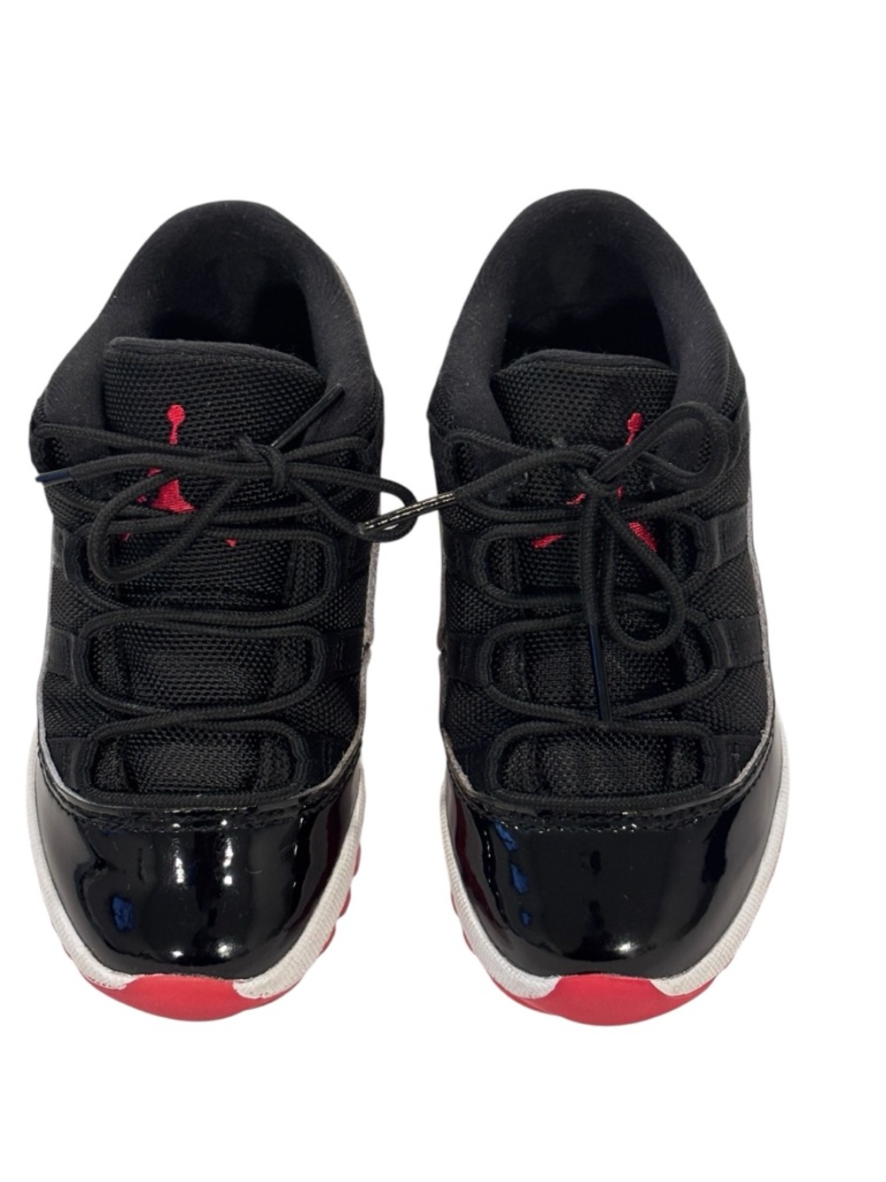 Jordan 11 Retro Low Top Sneaker for Toddler in Black White and Red